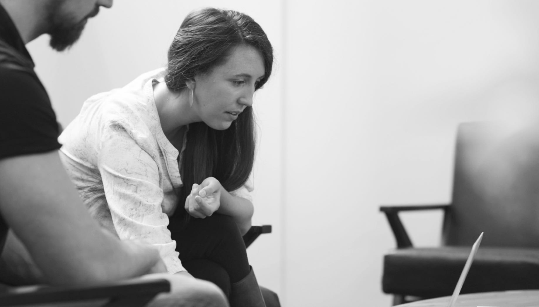 Man and woman looking at laptop computer