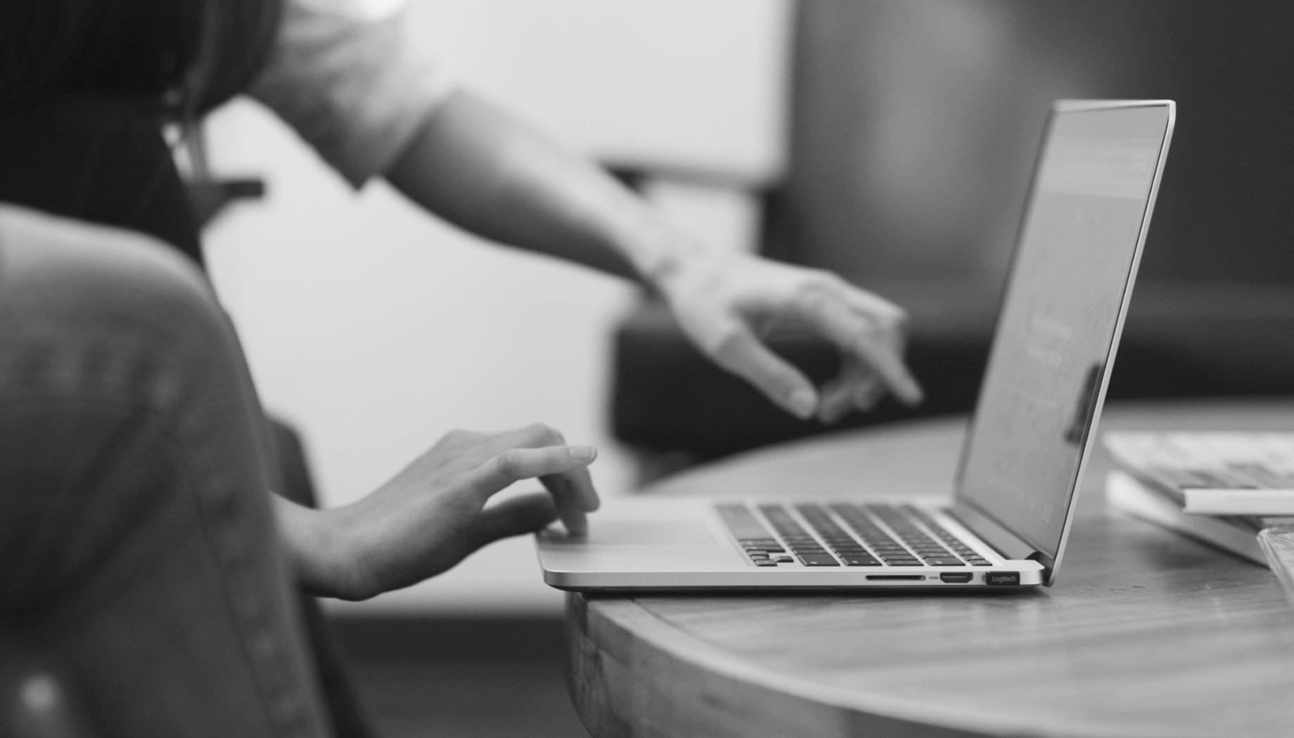 people looking at a computer